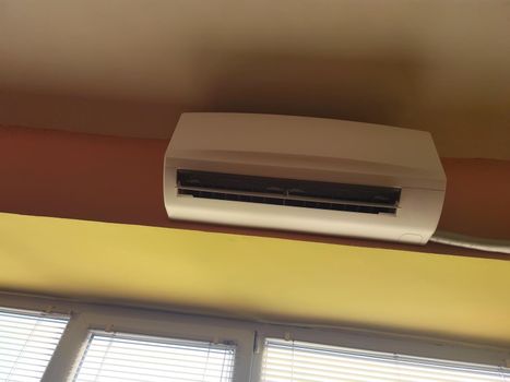 Air conditioner indoor unit mounted on office wall