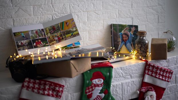 travel photo books lie near the Christmas tree. High quality photo