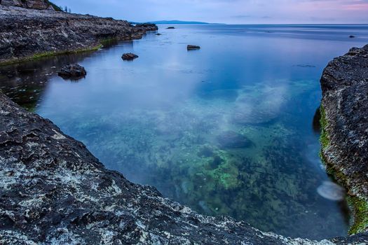 beauty and calm small bay at rocky coast. Nature background