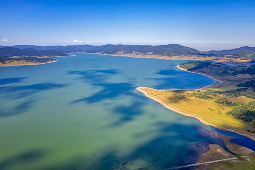 Scenic aerial view with a drone of an amazing Batak dam, Bulgaria with crystal water