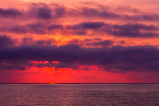 Amazing red sunrise or sunset over the sea. Nature background