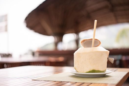 Fresh coconut at the tropical resort beach bar.