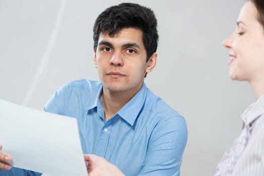 portrait of a young man at a business meeting. concept of team work