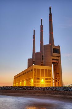 The decommissioned thermal power station at Sant Adria near Barcelona at twilight
