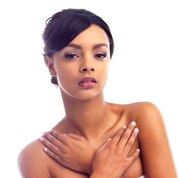 Studio portrait of a young woman with perfect skin isolated on white.