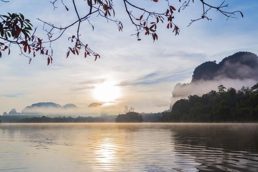 Ban Nong Thale the natural scenery of the sunshine in the morning (mountains, lakes, trees, fog) at Krabi, Thailand.
