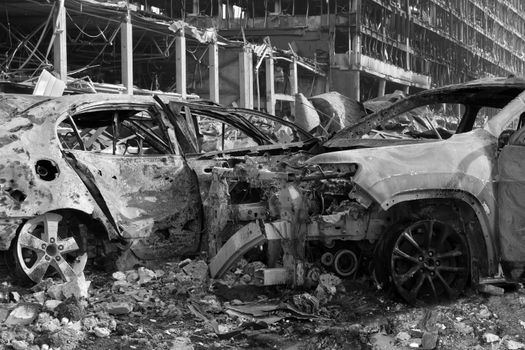 2022 Russian invasion of Ukraine war torn city destroyed car burn out. Aftermath shell of civilian bombed city damage car. Bomb attack Russia war damage Ukraine city war destruction Russian aggression