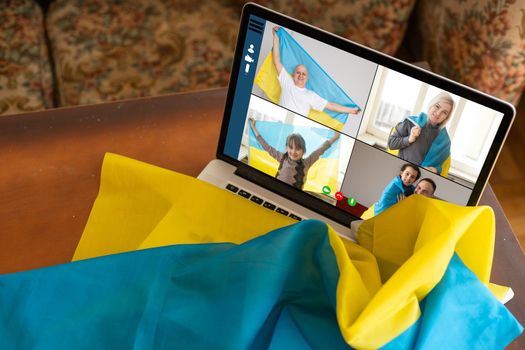 laptop near the ukraine flag. online conference.