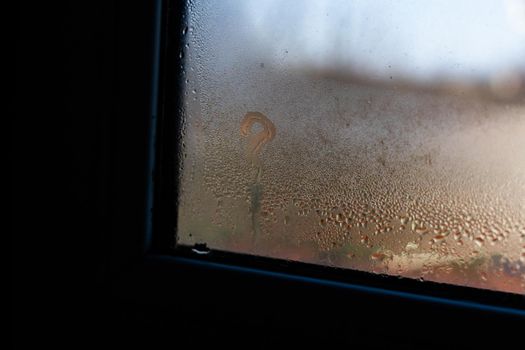 Wet window after autumn or winter rain.