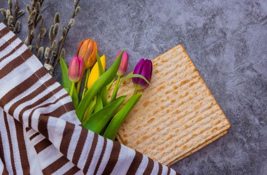 Jewish Passover holiday Pesach celebration with flowers matzah bread