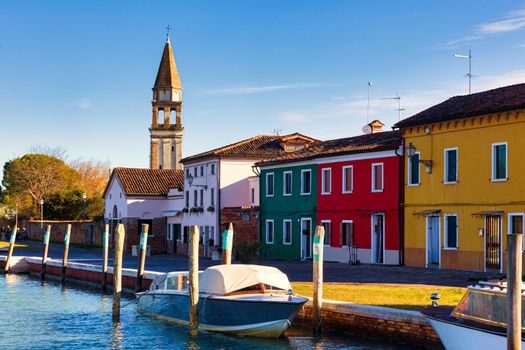 View of the San Michele Arcangelo bell tower and the colorful houses of Mazzorbo, Venice