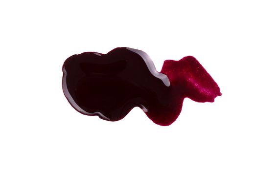 Spilled bordo nail polish isolated on white background. Blot of nailpolish. Nail varnish sample. Finger makeup beauty cosmetic spread. Squiggly sparkly cosmetic enamel. Woman cosmetic fashion product.