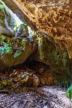 Amazing blue turquoise water and limestone cave sinkhole cenote at Santuario de los guerreros in Puerto Aventuras Quintana Roo Mexico.