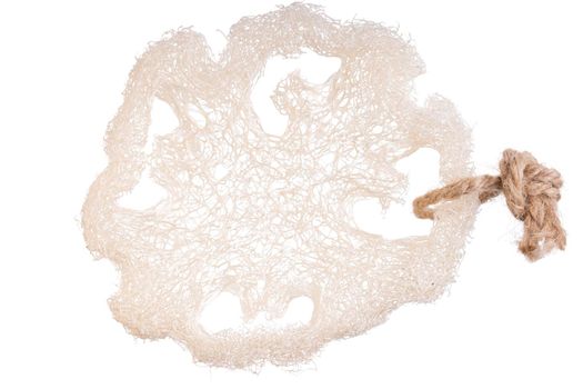 Loofah sponge close up isolated on white. Luffa sponge, fiber scrubber, cleansing beauty product. Thai scrub for clean skin. Alternative to plastic, zero waste, eco friendly. Scrubbing bath brush