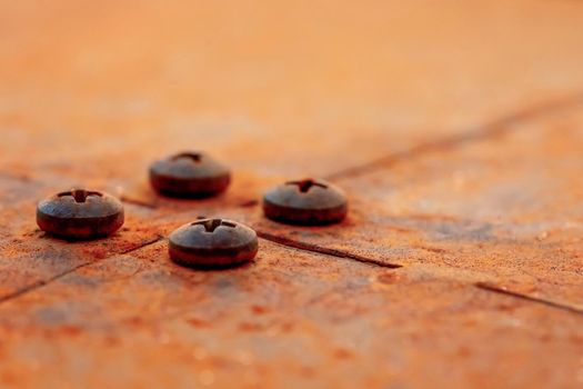 Grunge metal rust texture, rusted and oxidized metal background with bolts. Old metal iron panel surface. Macro