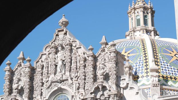 Spanish colonial revival architecture in Balboa Park, San Diego, California USA. Historic building, classic baroque or rococo romance style. Bell tower or belfry relief decor and mosaic dome or cupola