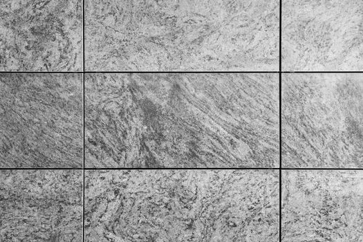 Natural grey granite texture tile wall, gray travertine marble, rock surface background. Grunge abstract backdrop. Stone concrete pattern