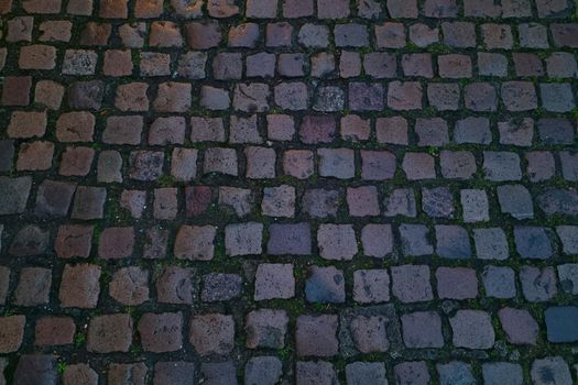 Dark background of stone texture, paving slabs in the city