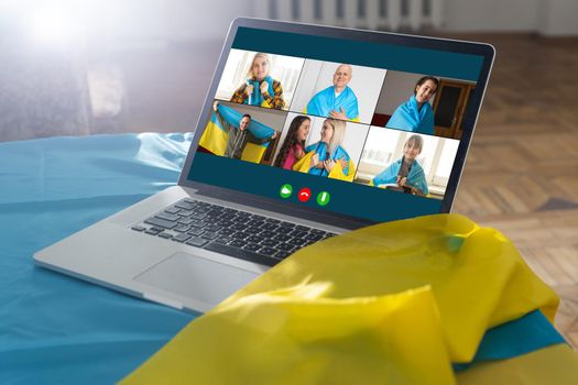 laptop near the ukraine flag. online conference.