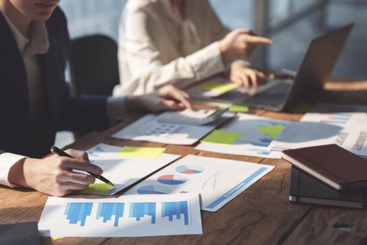 Fund managers team consultation and discuss about analysis Investment stock market by financial paperwork