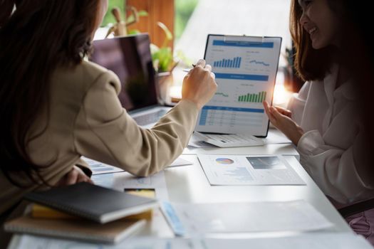 Analytics intelligence concept. Group of business people discuss current financial and economic on laptop for investment at the meeting