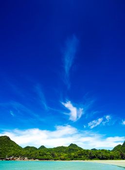 Wide view of beach, sea and the mountain with blue sky background