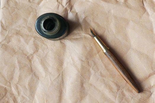 old empty paper and fountain pen on table .