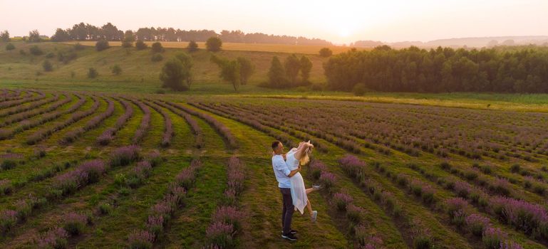 Young couple playing around in the lavender fields.