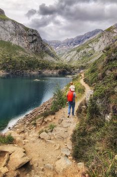 Tourists near a french lake at the high pyrenees