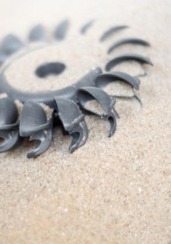 Old water turbine on dried sand with out water, useless in drought condition