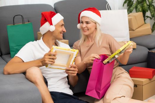 couple with gifts at christmas