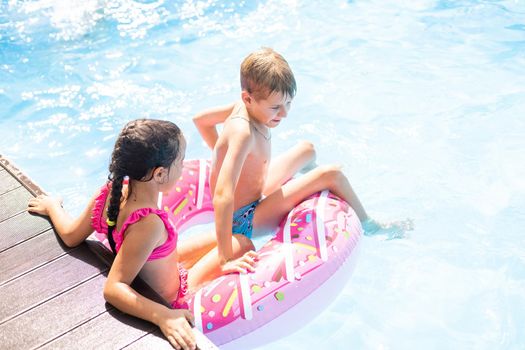 little kids swimming in pool