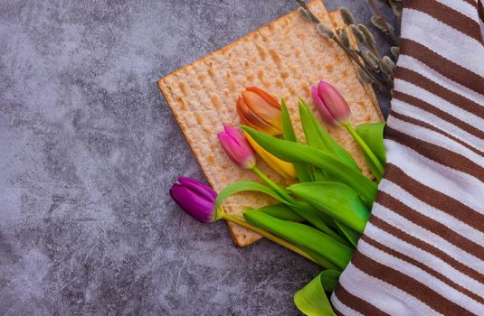 Pesach celebration holiday the flowers matzah bread with Jewish Passover