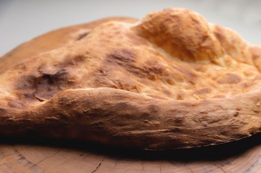 Close-up of fresh appetizing pita bread. delicious baked food.