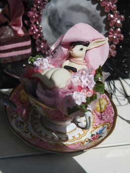 London, UK - 17 June 2019, Showcase in the Liberty store on Regent Street. Ceramic figurine of a rabbit in a porcelain cup, painted with flowers