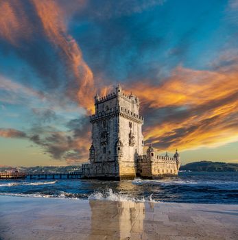 Composition of sunset over Belem tower with reflection