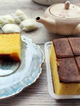 egg biscuit, japanese mochi dessert and teapot on the table.