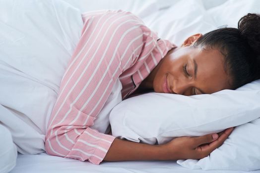 Shot of an attractive young woman peacefully sleeping in bed at home.