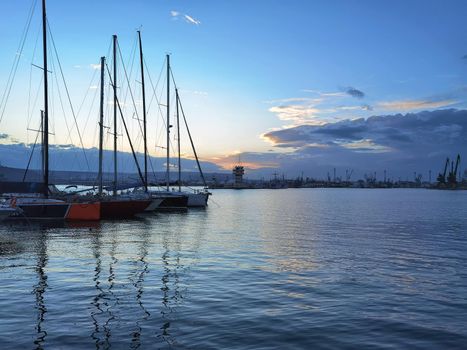 Yachts and boats at sunset in the harbor. Black sea, Varna, Bulgaria.