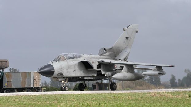 Andravida Greece APRIL, 1, 2022 Ground attack NATO combat plane on airport runway. Panavia Tornado IDS ECR of Italian Air Force