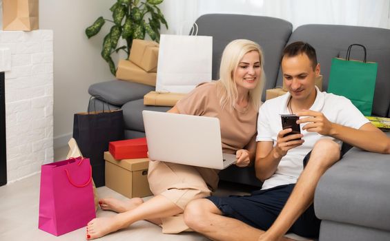 Young couple shopping online with laptop