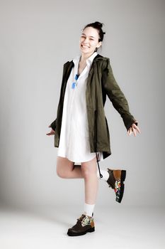 Full body shot of a fashionable young woman with cool clothes.