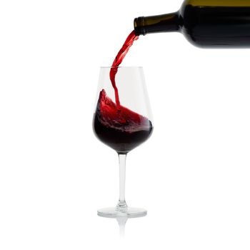 Tasty Red Wine with splash in glass isolated on white background.