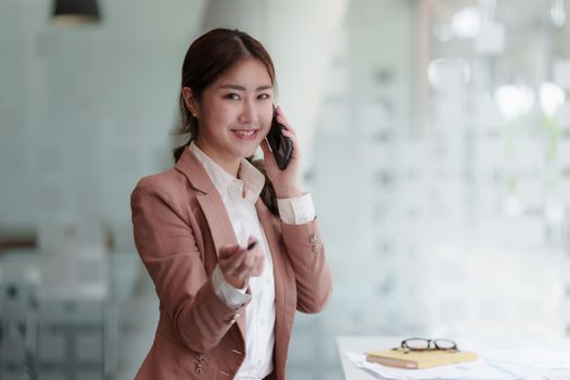 Modern Asian Business woman have confident working with financial at office. Accounting concept