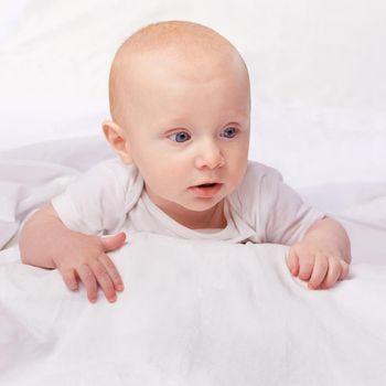 Cropped shot of an adorable baby boy in a studio.