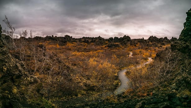 Lava fields under dark cloudy day