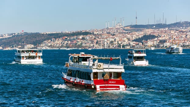 Istanbul, Turkey - 1 April, 2017: Passenger ships crossing Bosporus at spring day.