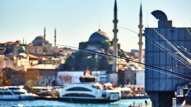 The Galata bridge with fishermen at sunny day