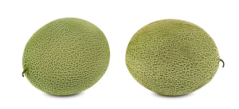 Two sweet cantaloupe melons isolated on white background with copy space for text or images. Pumpkin plant family. Side view. Close-up shot.