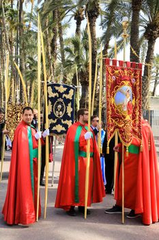 Elche, Alicante, Spain- April 10, 2022: People with white palms for the Palm Sunday of the Holy Week of Elche